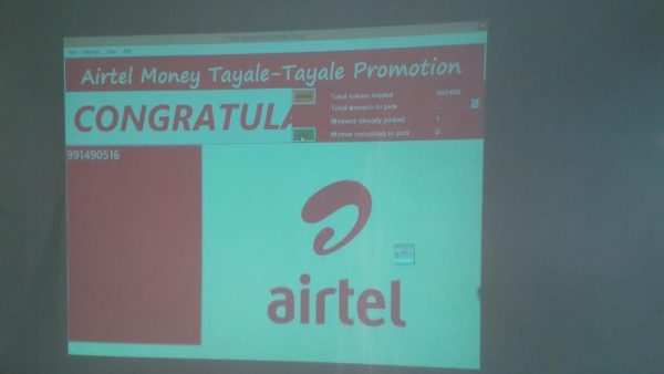 The winning number is displayed on a screen