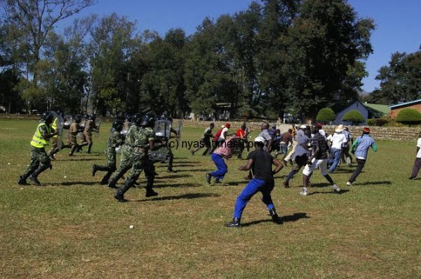 Police officers demonstrate on how to deal with protesters during the event.