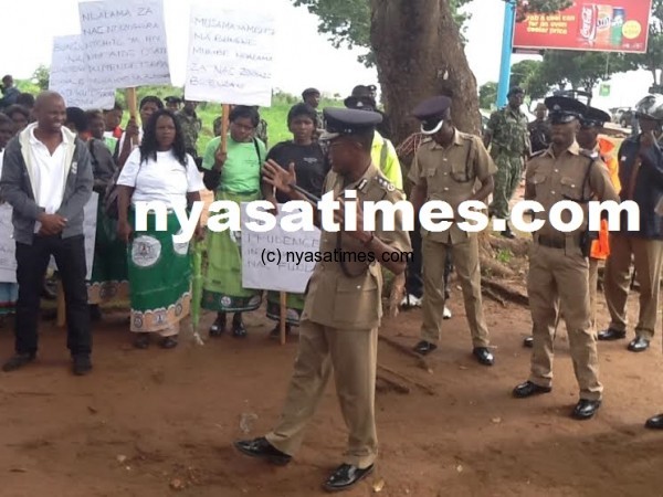 Police officers addressing protestors