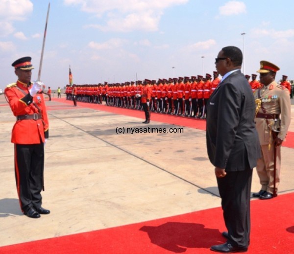 Mutharika inspects guard of honour at KIA after his arrival from SADC Summit in Zimbabwe-Pic. by Abel Ikiloni