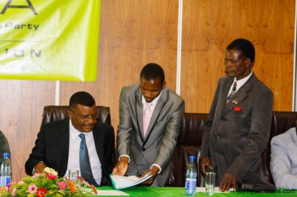 Chibambo and other officials. Far right is vetaran politician Odinga Chifi