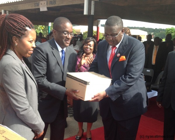 The director hands over sample of drugs to veep Kachali.-Photo courtesy of VP press office