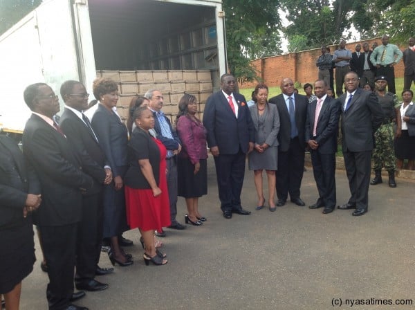 Veep and minister of health pose with officials on drug consignment.-Photo courtesy of VP press office 