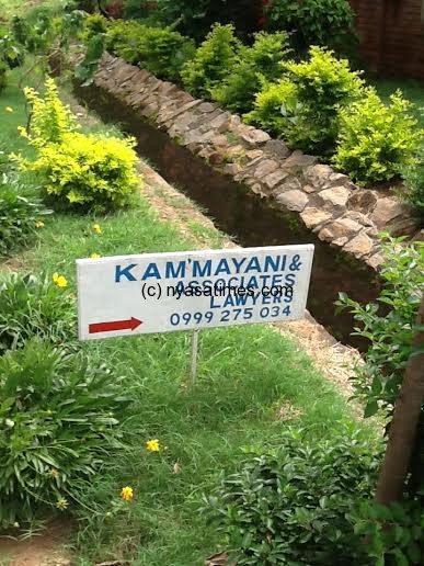 Sign post leading people to the closed office of Kam'mayani in Area 47
