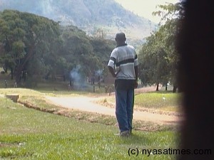 Man watches police fire teargas to students