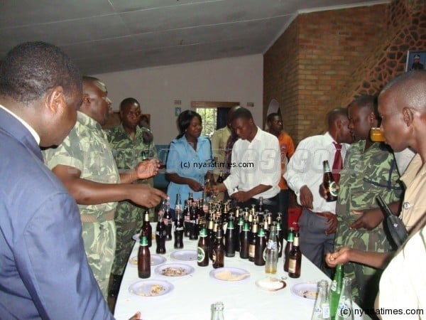 Beer party: Malawi cops drink up  for a longer life.