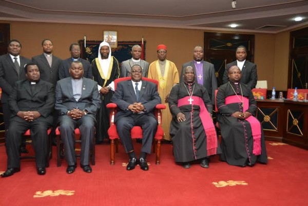 Scones in their mouth? Mutharikapose for a photo with religious leaders at State House when they paid a courtesy call to him