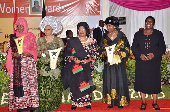 President Banda pose with the four awardees