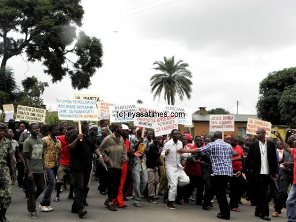 Part of the demostrators carrying placards on their way to Blantyre Civic Centre offices- Pic Lucky Mkandawire