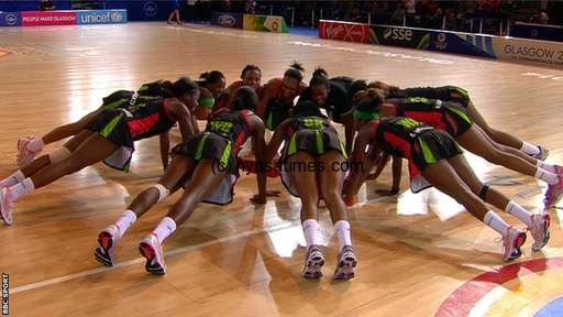  Malawi's ladies netball team celebrate their victory over South Africa by performing press-ups on the court.