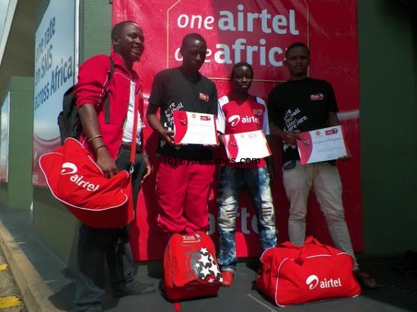 The Rising Stars show off their certificates after arrival. Standing far left is Emmanuel Kaunda from Airtel