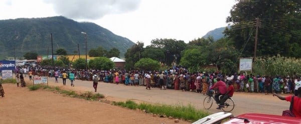 Frustration is growing in Malawi over maize shortage: Multitudes of people queuing for maize at Admarc deport .