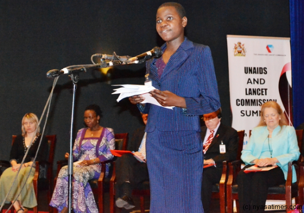 Shireen Mvula, a young person living with HIV, speaking to the delegates  during the openning of the conference.