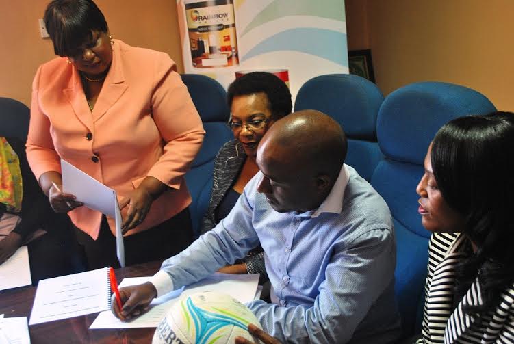 Signing the dotted lines of the deal: Rainbow Paints marketing manager Silas  -Photo Jeromy Kadewere, Nyasa Times