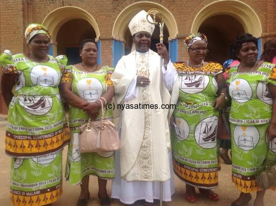Stima with members of the church after the farewell mass