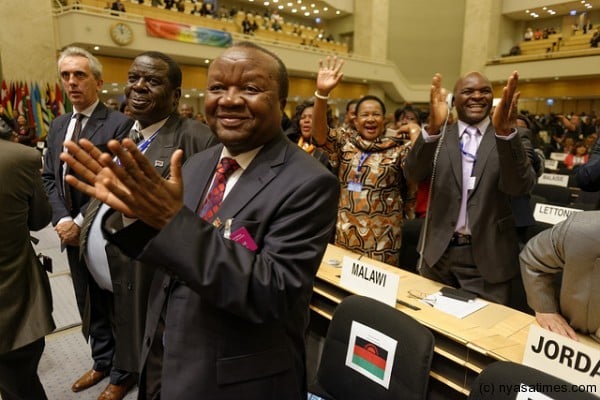 Malawi delegation join in the standing ovation after President Banda's speech