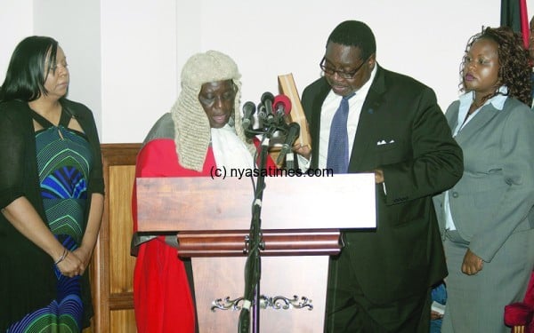 President Peter Mutharika takes his oath of office alongside Chief Justice Anastansia Msosa
