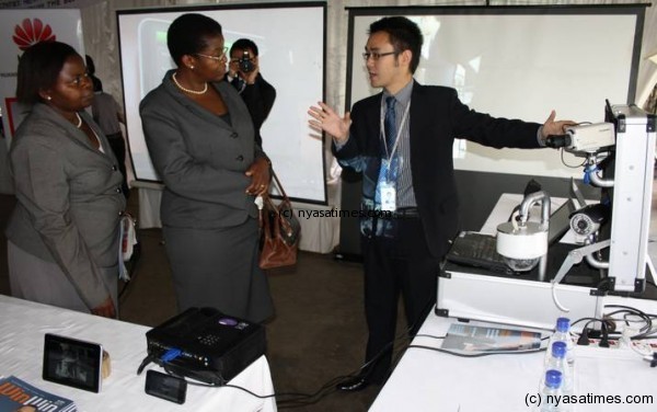 Chief Secretary Hawa Ndilowe in the midle as E government PS Chikankheni looks on at ICT week exhbition