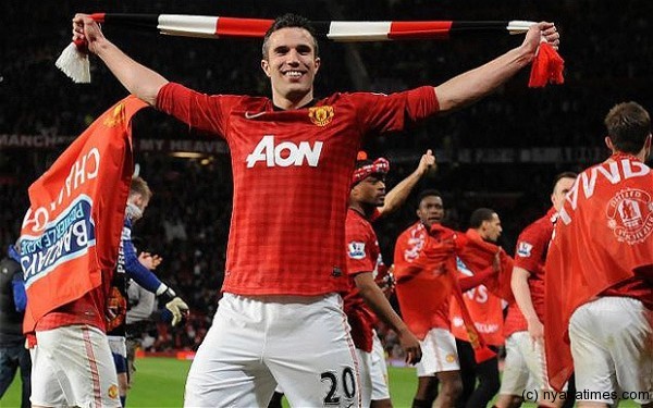 Champion performance: Van Persie celebrates after his hat-trick helped Manchester United to win the Premier League title.  Photo: EPA