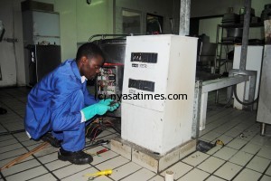 An electrician rectifying the problem at Mwaiwathu Private hospital.Pic Francis Mphweya-MANA