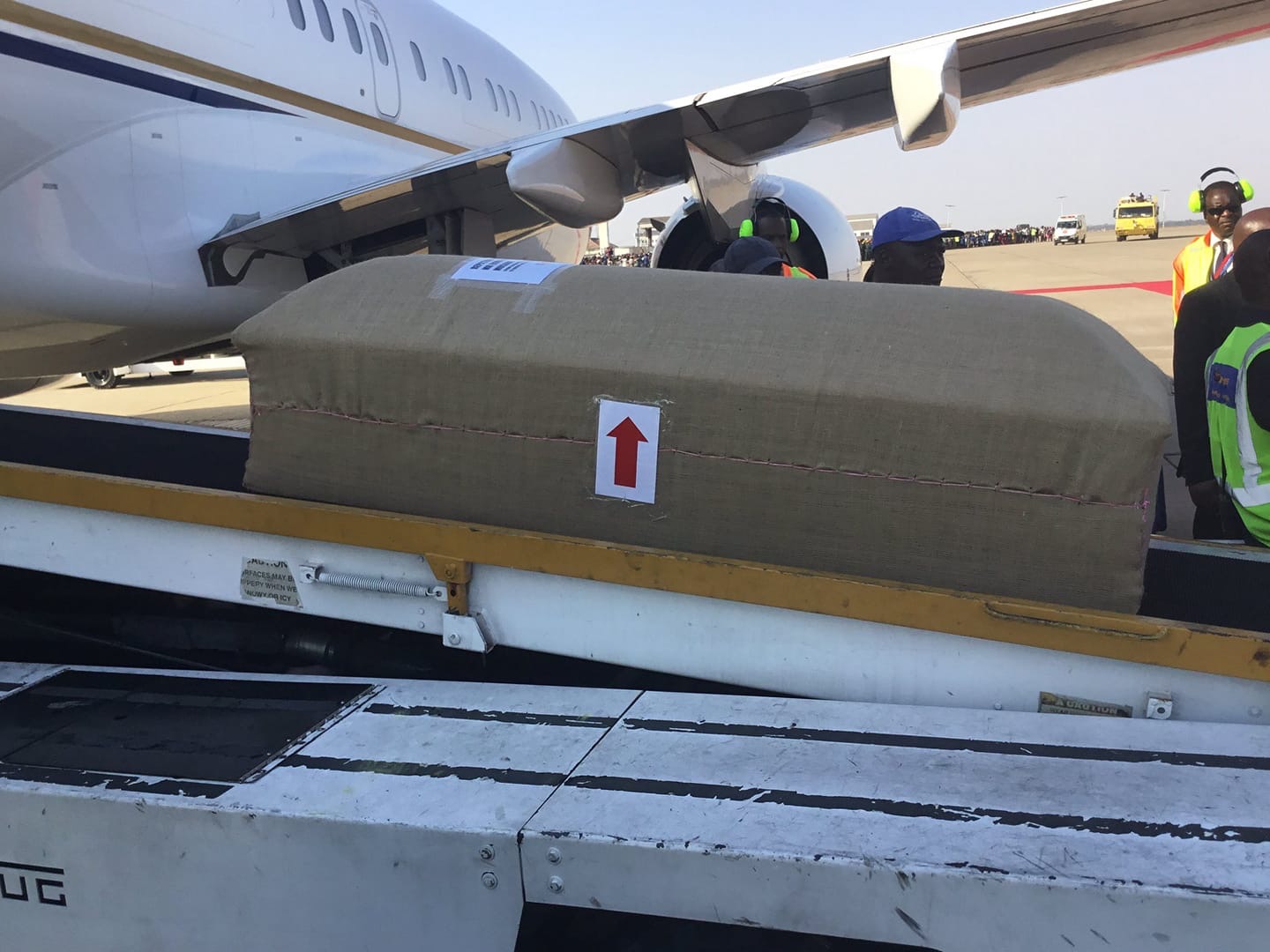 Mugabe’s body arrives in Zimbabwe, casket brought from cargo section of