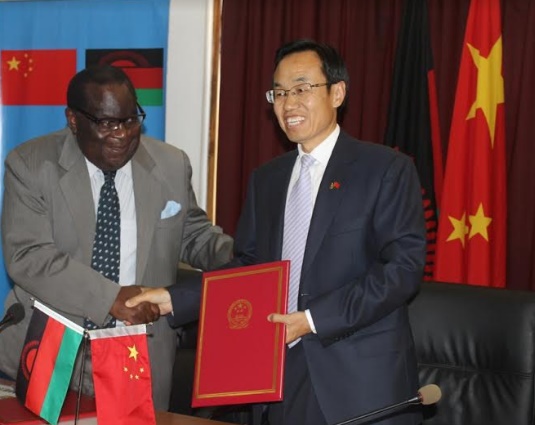 Malawi Finance Minister Goodall Gondwe and Chinese Ambassador Shi-ting Wanga signs a framework agreement on the provision of Concessional loan by China to Malawi National Fiber backbone-pic by Lisa Vintulla