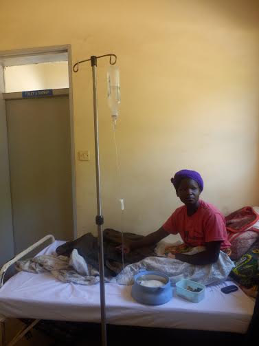 A patient at Chitowo Health Centre, wait ing for a health worker who reportedly did not .. come t the hospital since morning.J