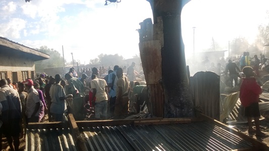 People gather at the burnt market - Pic by Watoson Maingo