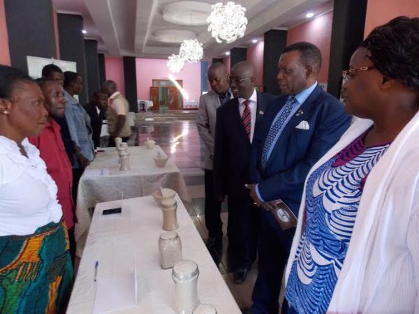 Chaponda (2 Right) interacts with some of the farmers that attended the rice conference.
