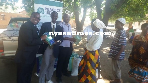 MP Jumbe presenting the seeds