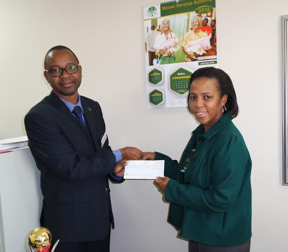 MRA-Wilma-Chalulu-making-a-donation-to-MISA-Malawi-through-Mandala-Mambulasa