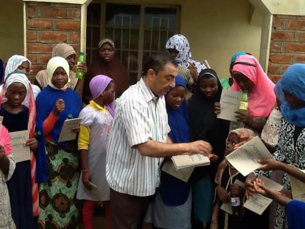 Omar giving out to Khadija oprhanage