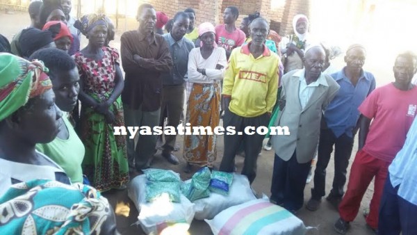 Some of the beneficiaries pose for the camera with their seeds