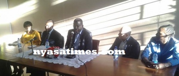Sy addressing a news conference