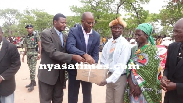 Symbolic presentation of building materials to some beneficiaries