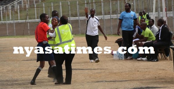 The fourth official being prevented to go to Dedza bench ... ...Photo Jeromy Kadewere