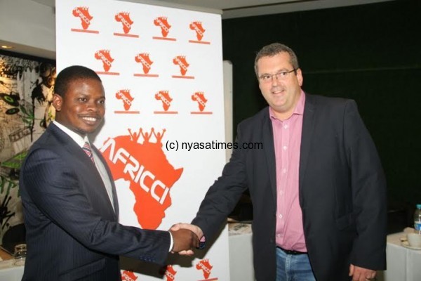 Bushiri shakes hands with a delegate after after presentation in South Africa